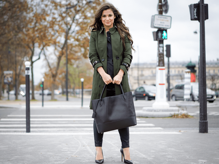 Green trench coat and black bag