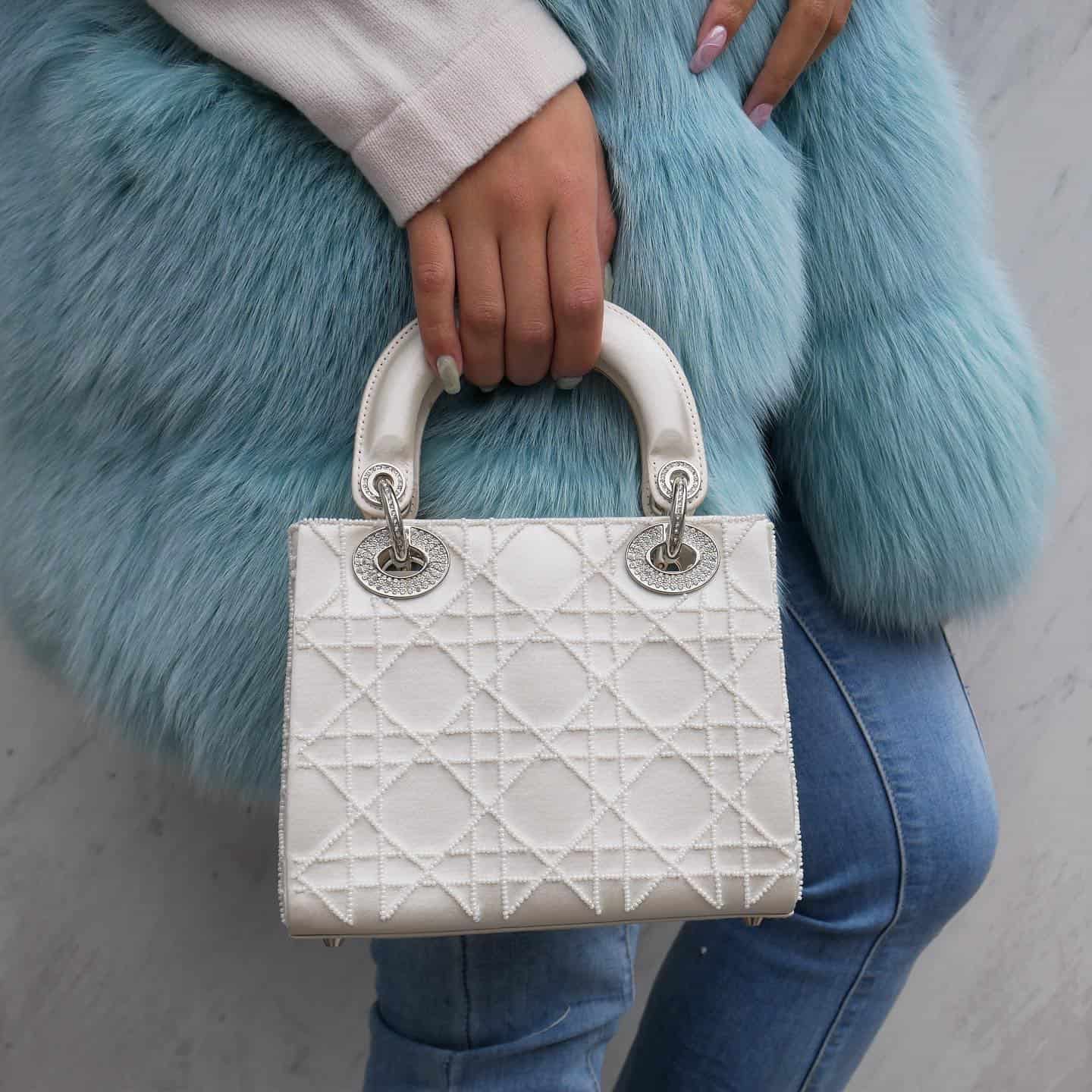 Closeup of a limited edition white lady dior bag