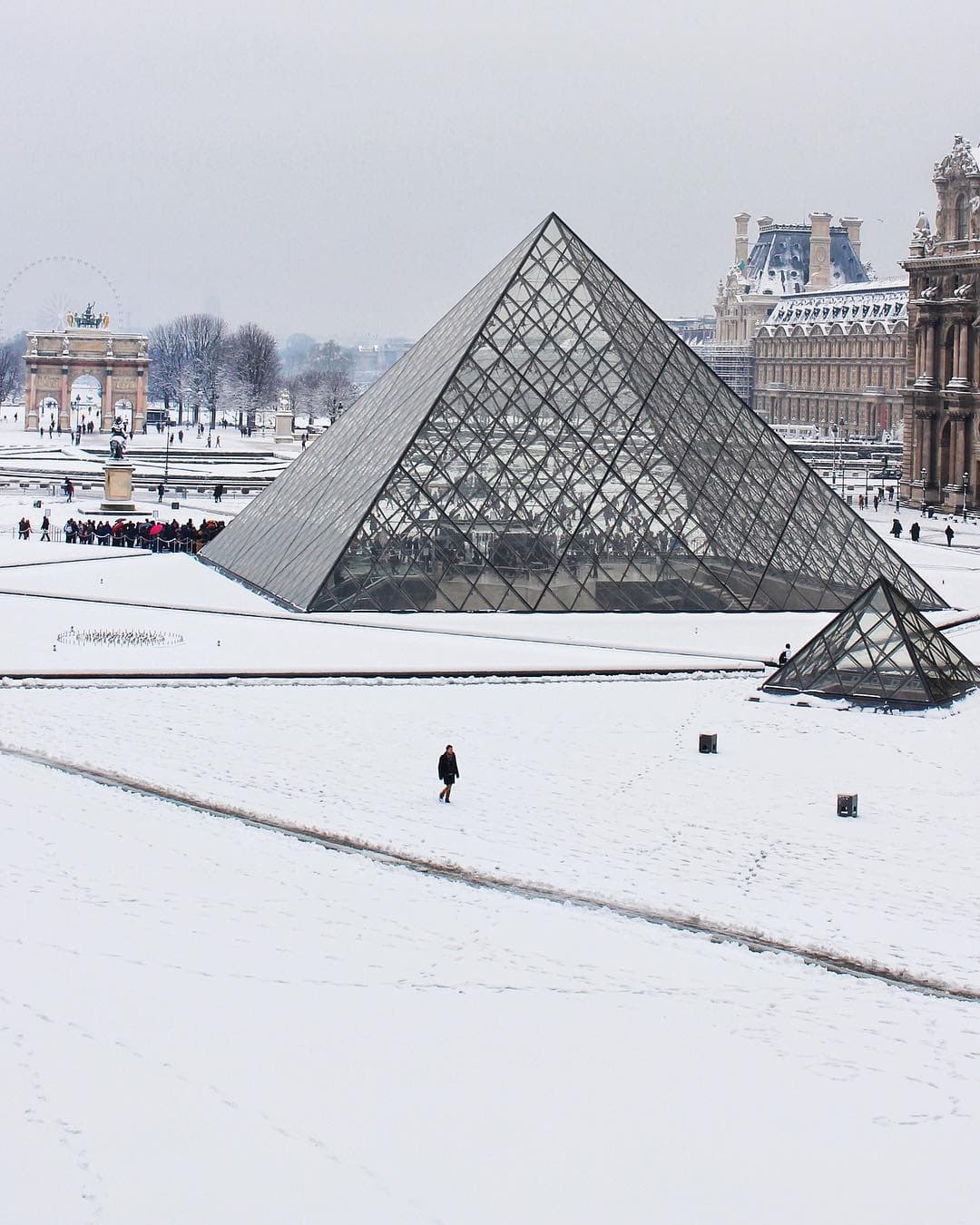 Louvre in the snow in Paris