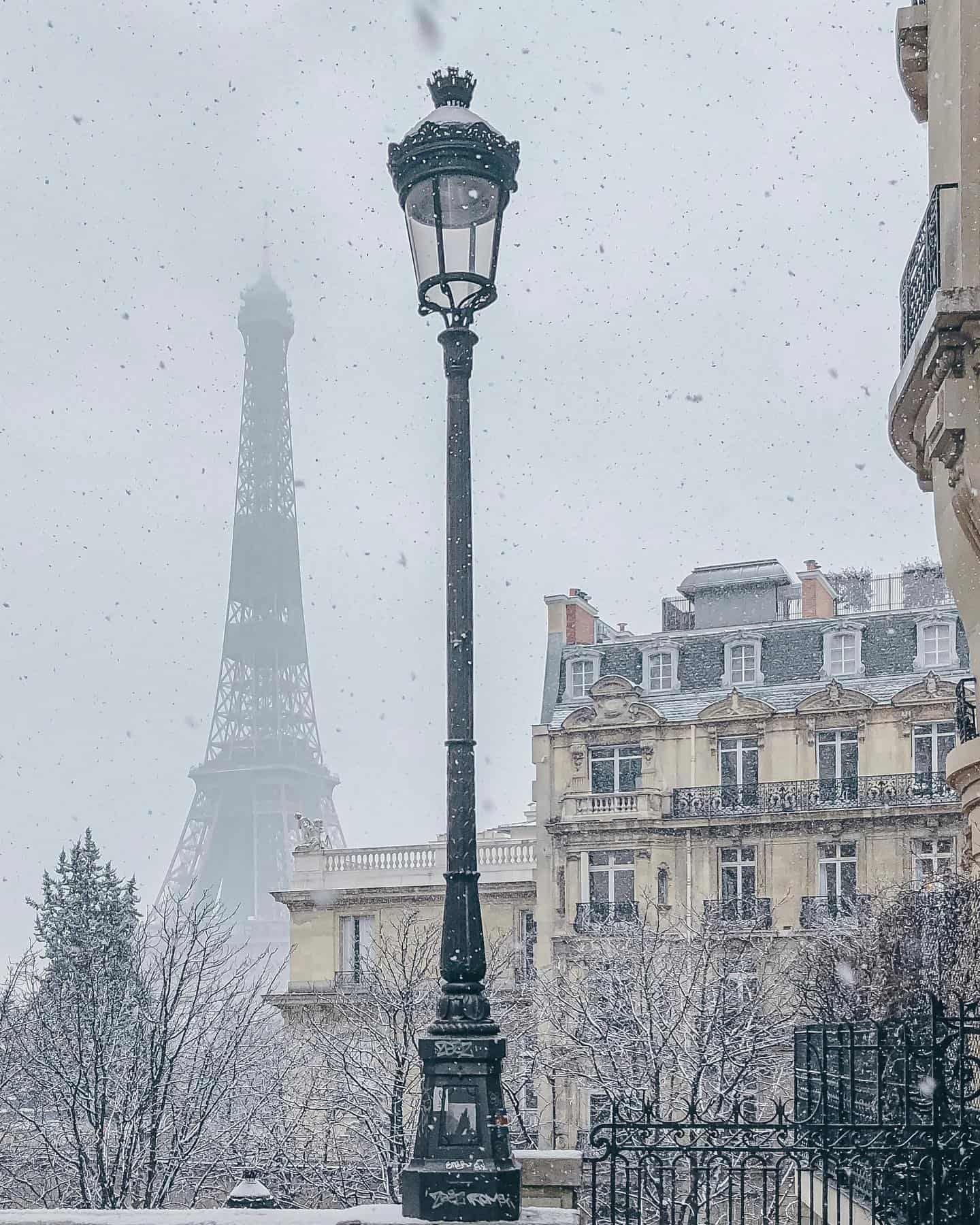 Snowing in Paris at the Eiffel Tower